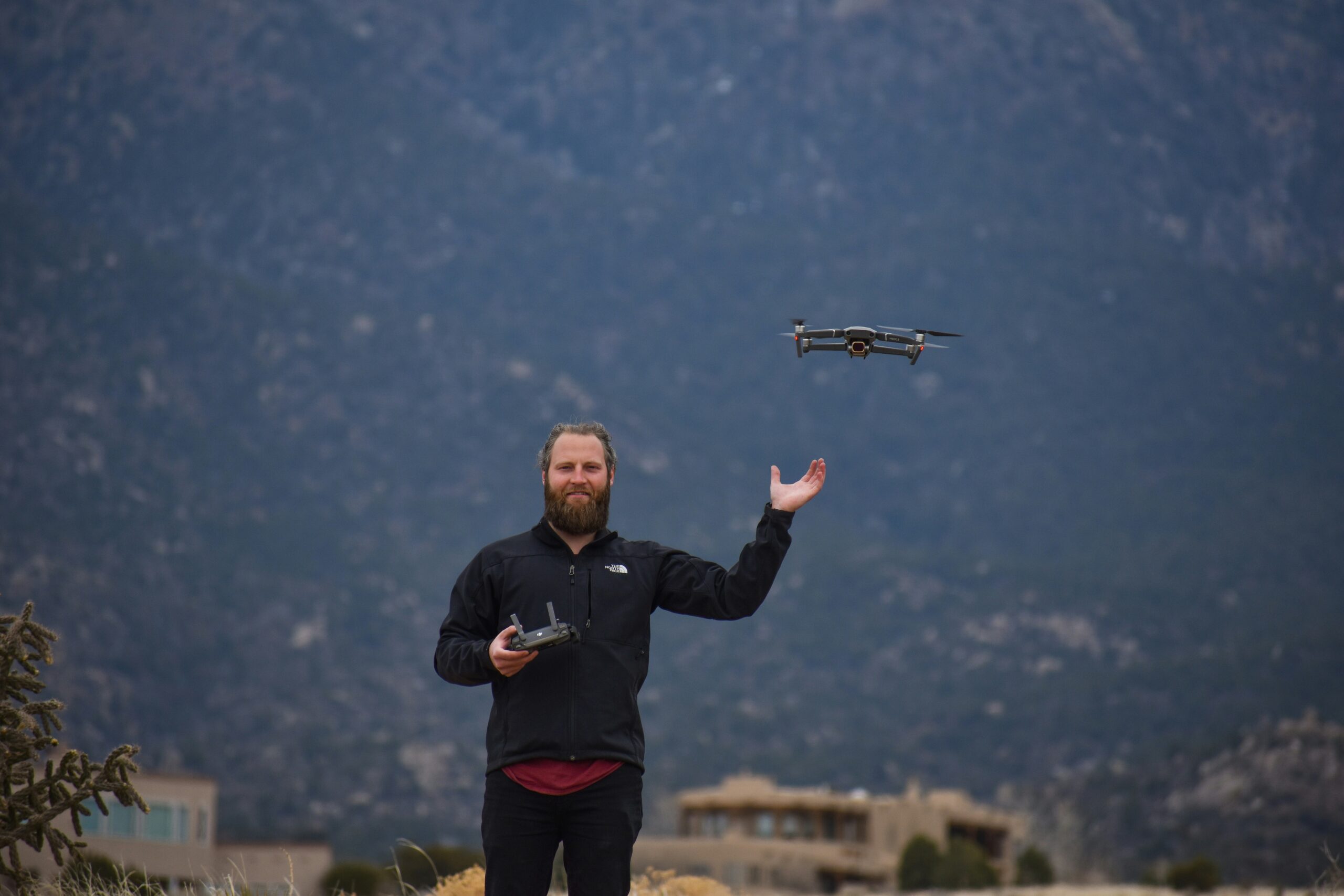 Person flying drone with remote